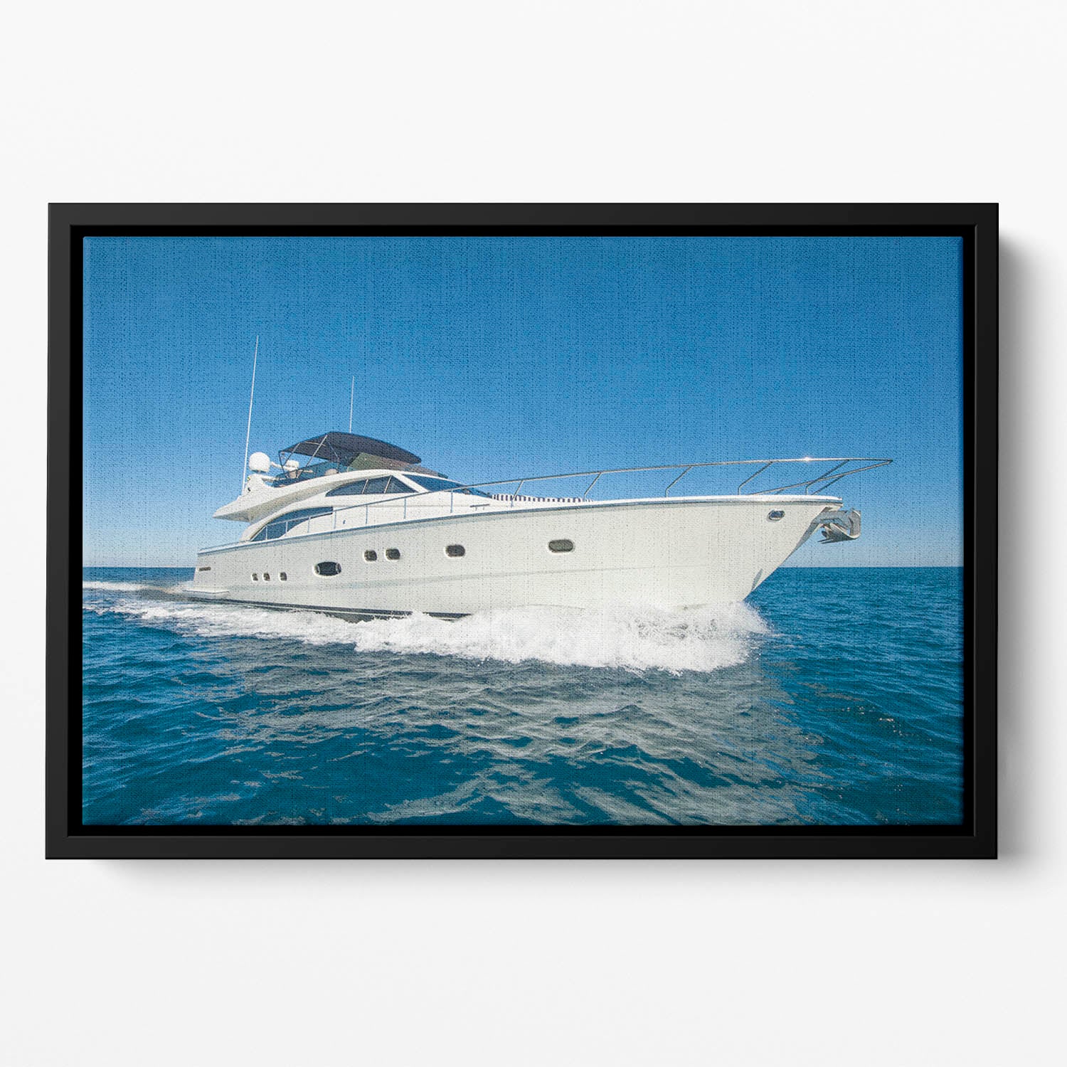 A luxury private motor yacht Floating Framed Canvas