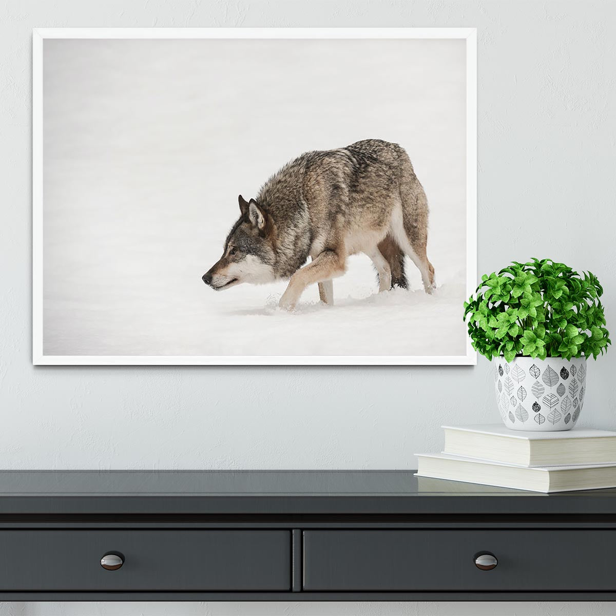 A solitary lone wolf prowls through snow Framed Print - Canvas Art Rocks -6