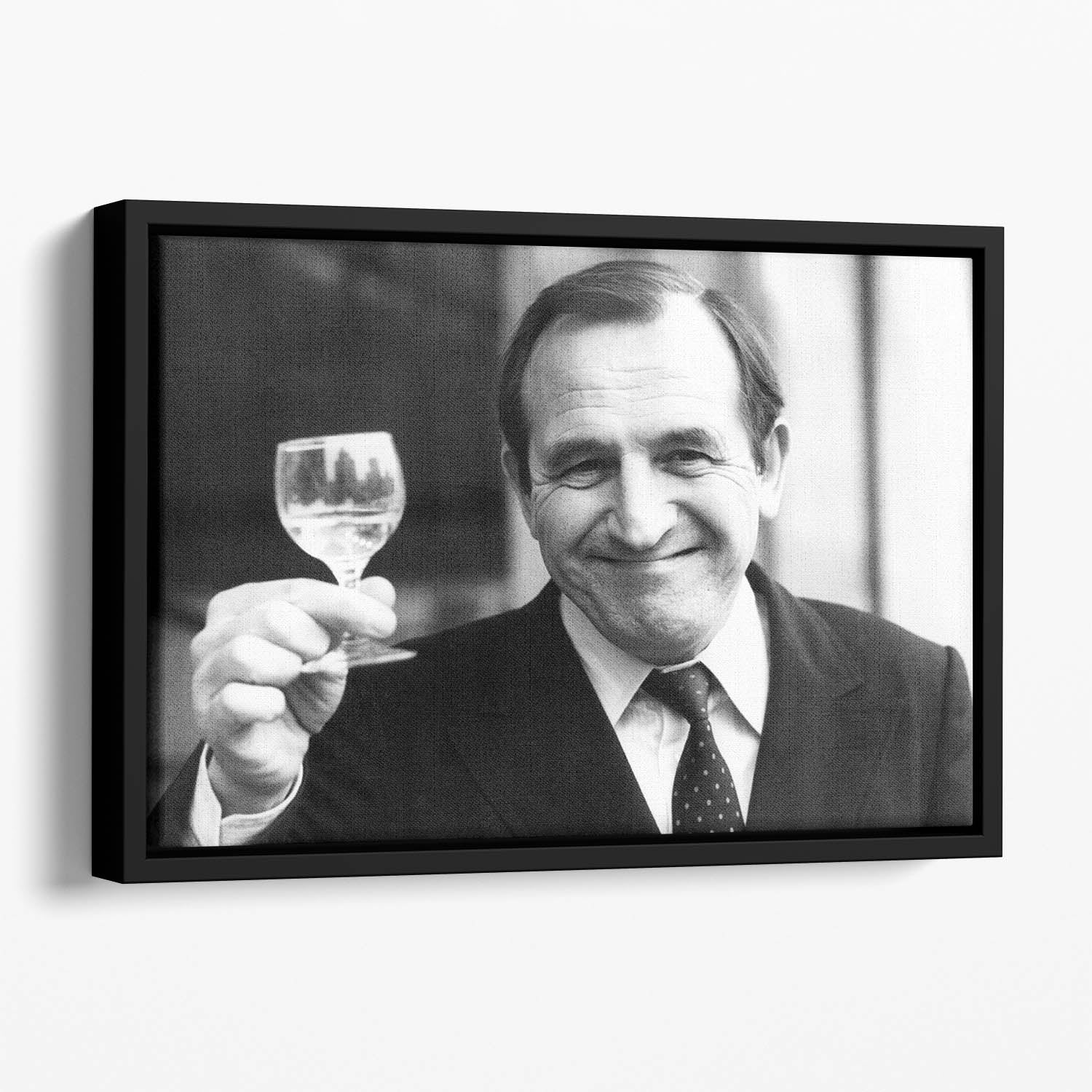 Actor Leonard Rossiter raises a glass Floating Framed Canvas