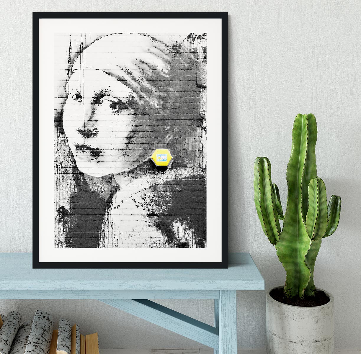 Banksy Girl With a Pierced Eardrum Framed Print