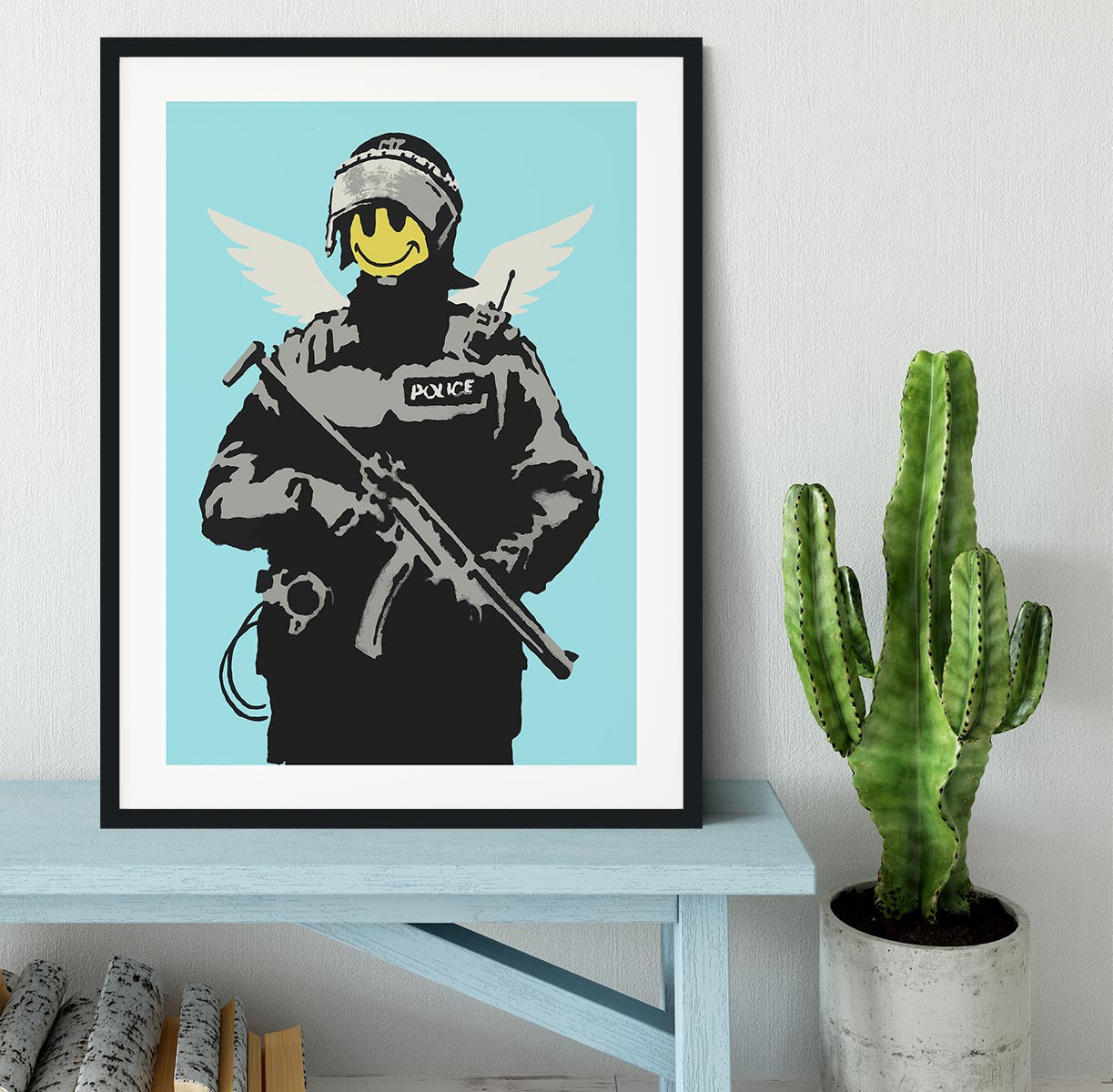 Banksy Smiley Angel Policeman Light Blue Framed Print - Canvas Art Rocks - 1