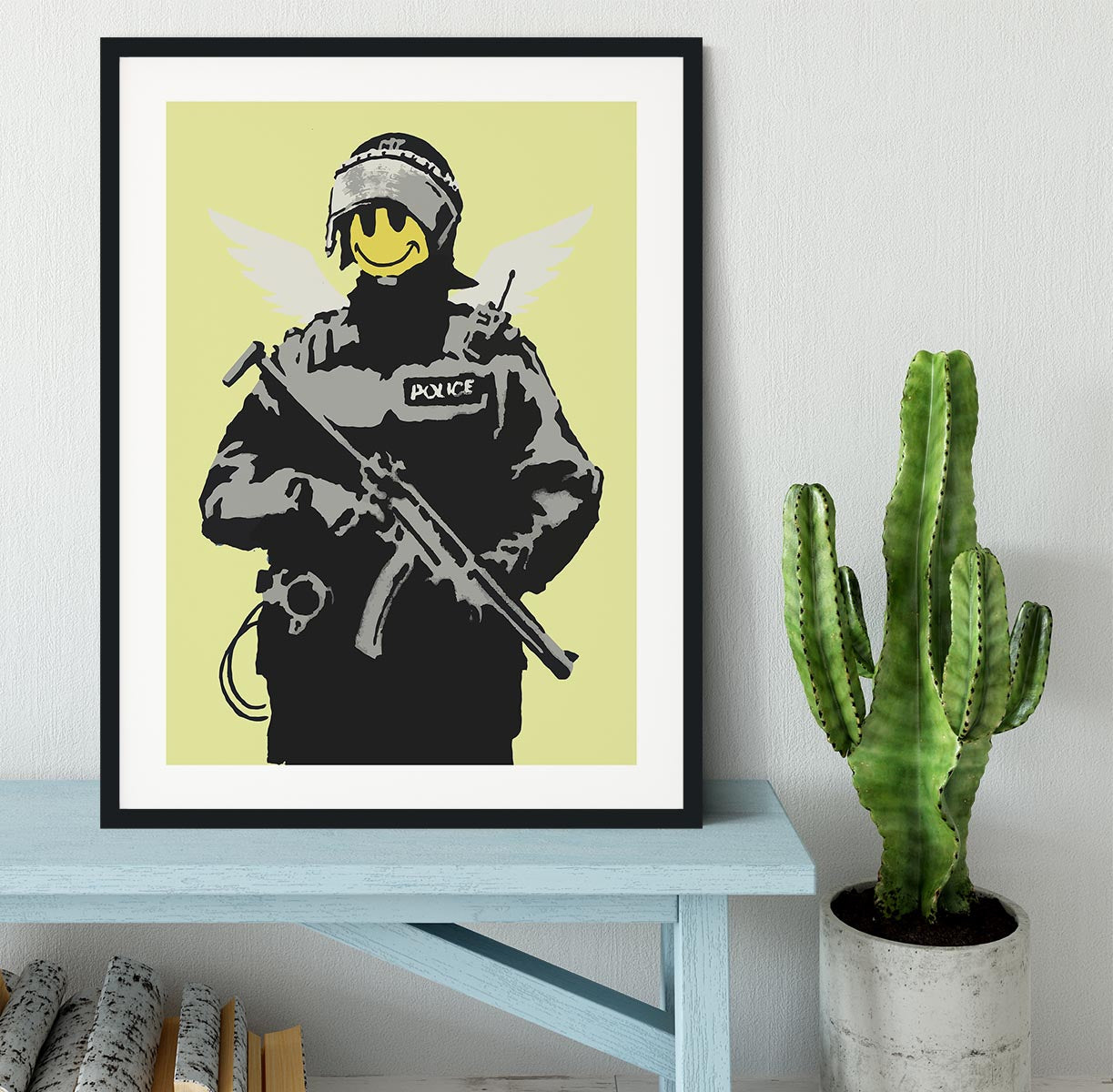 Banksy Smiley Angel Policeman Yellow Framed Print - Canvas Art Rocks - 1