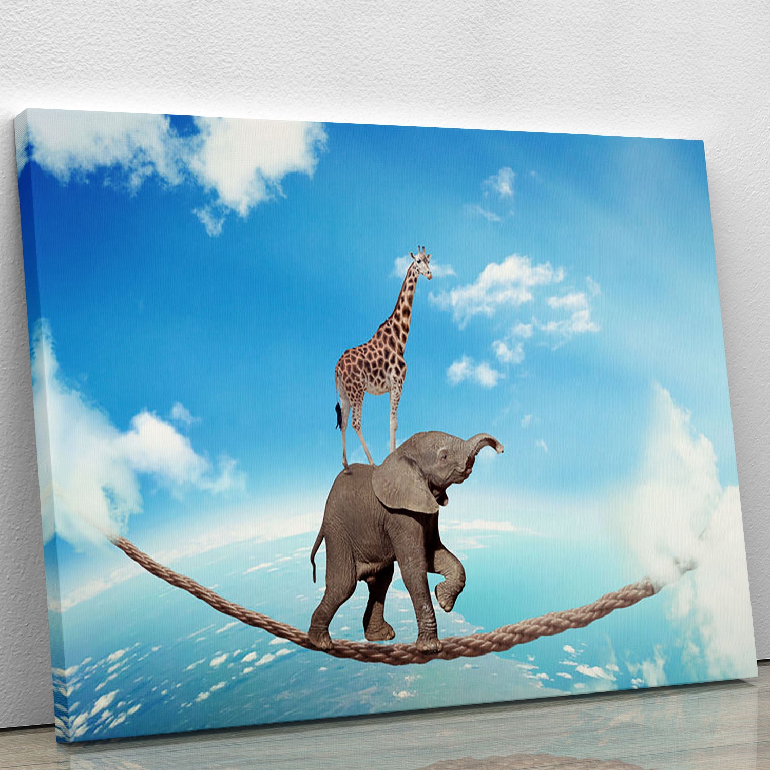 Elephant with giraffe walking on dangerous rope high in sky Canvas Print or Poster - Canvas Art Rocks - 1