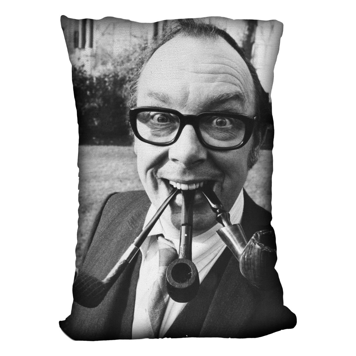 Eric Morecambe with three pipes in his mouth Cushion