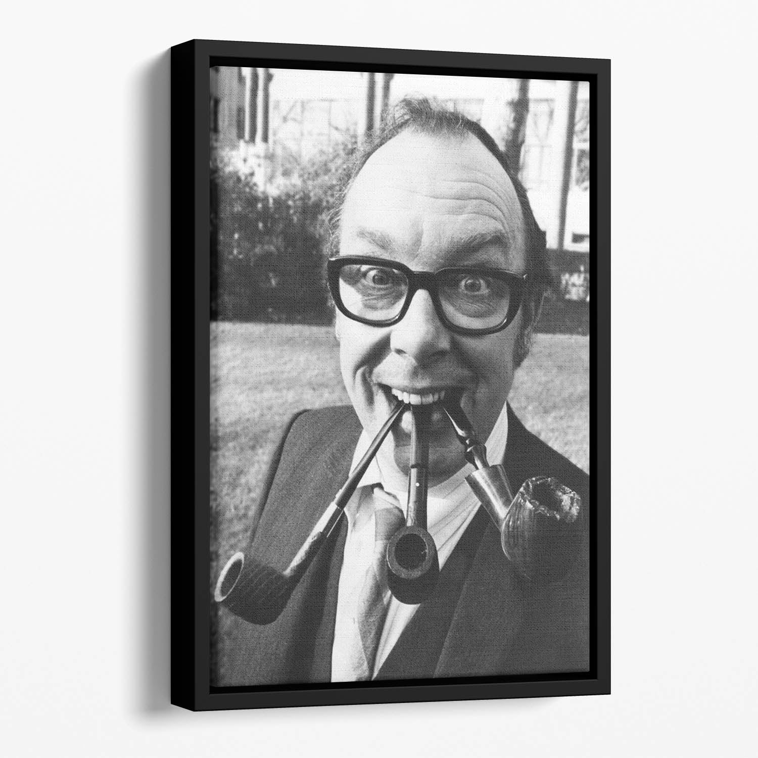 Eric Morecambe with three pipes in his mouth Floating Framed Canvas