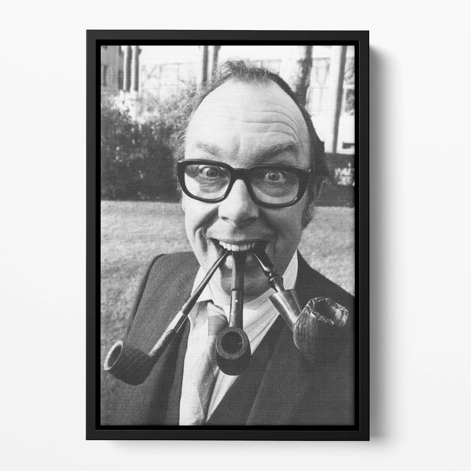 Eric Morecambe with three pipes in his mouth Floating Framed Canvas