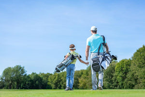 Father and son on golf course Wall Mural Wallpaper - Canvas Art Rocks - 1