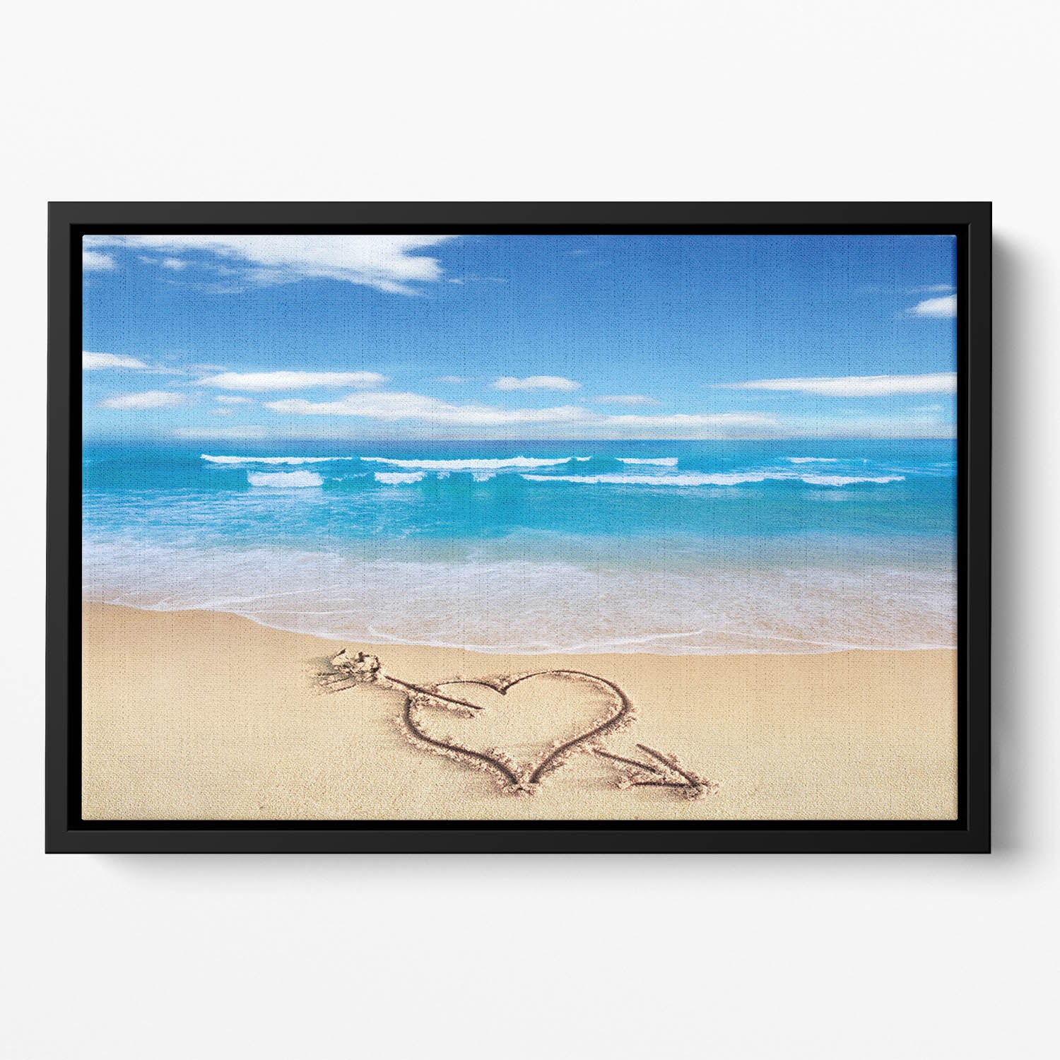 Heart with arrow in sand Floating Framed Canvas