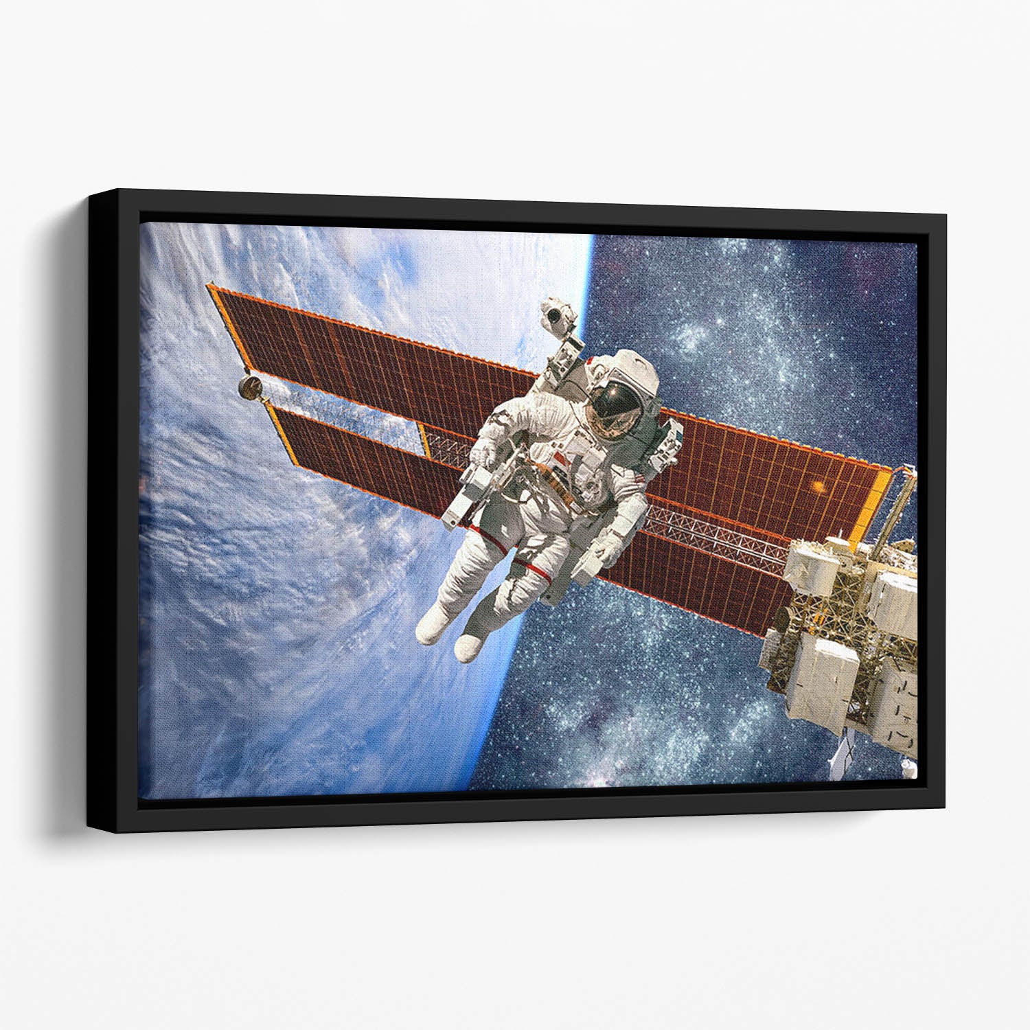 International Space Station and astronaut Floating Framed Canvas