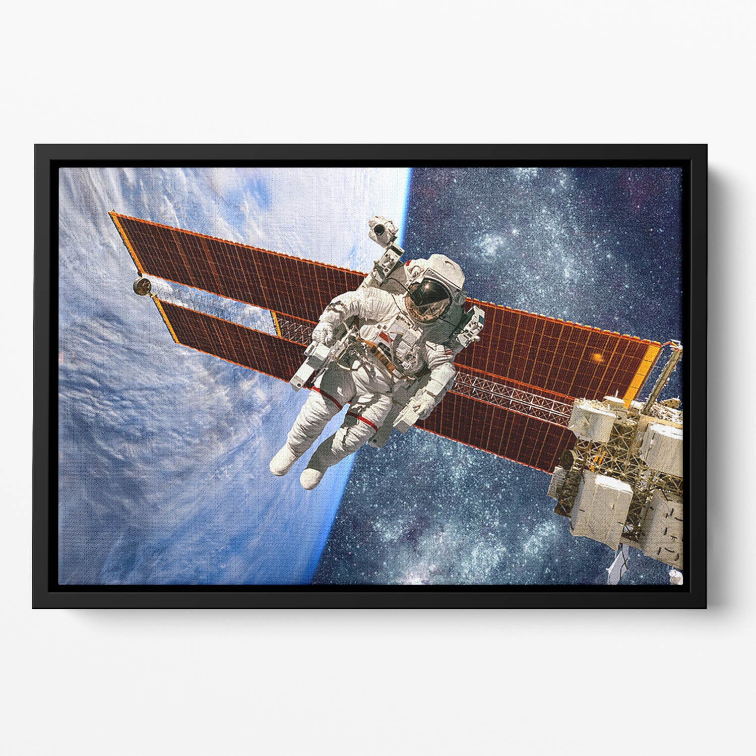 International Space Station and astronaut Floating Framed Canvas