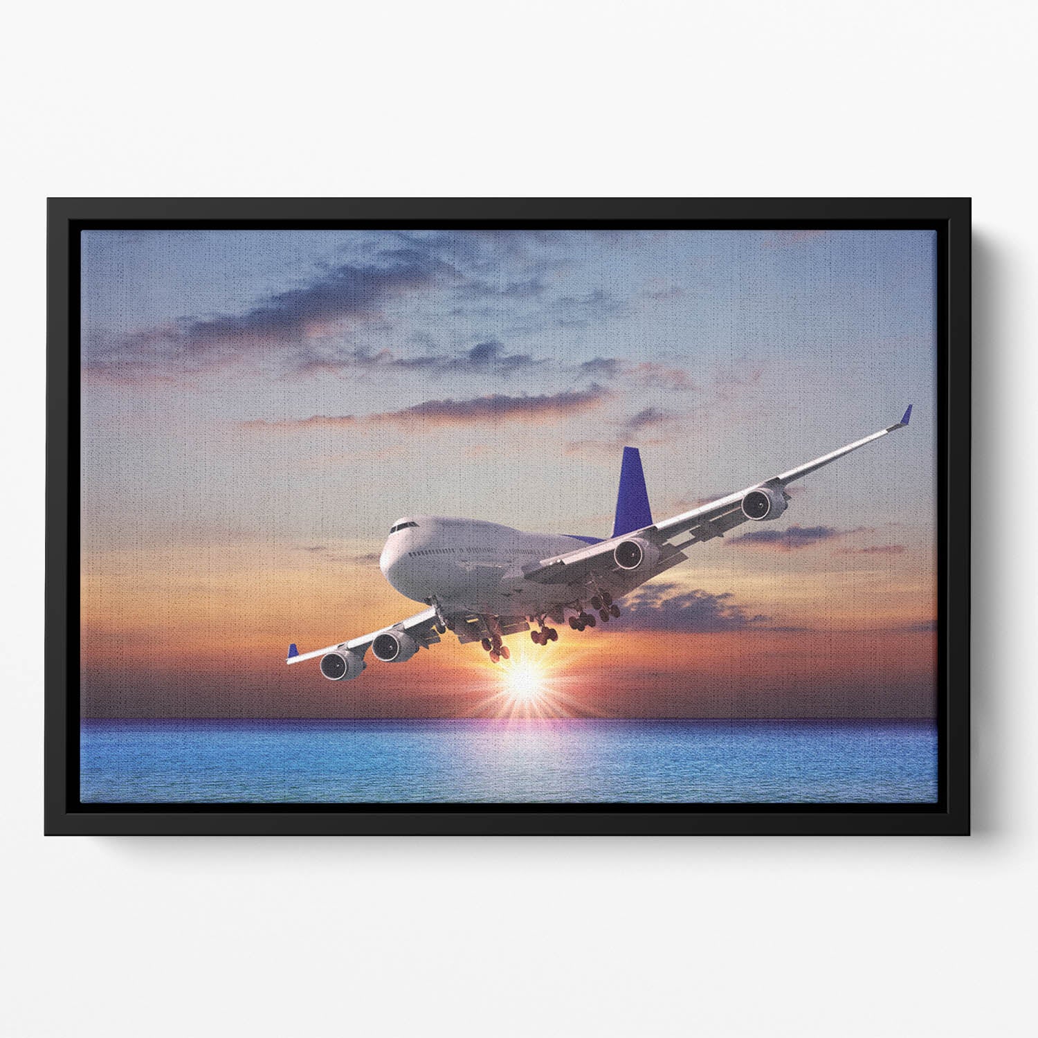 Jet liner over the sea at dusk Floating Framed Canvas