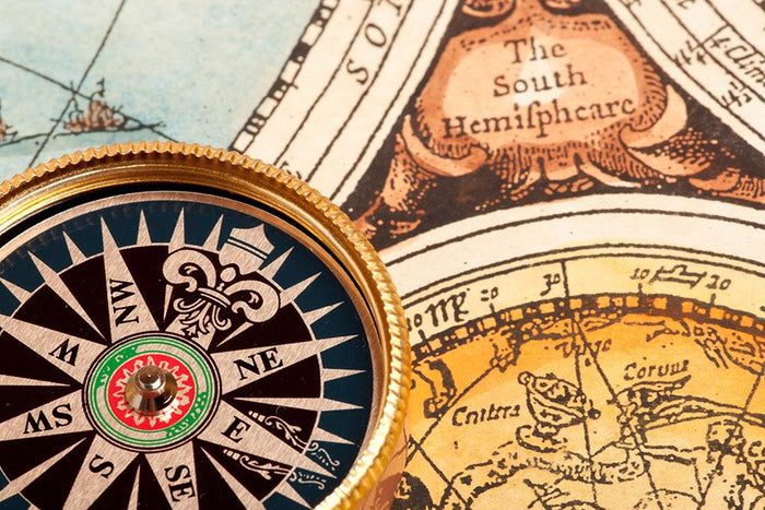 Old compass on vintage retro map Wall Mural Wallpaper