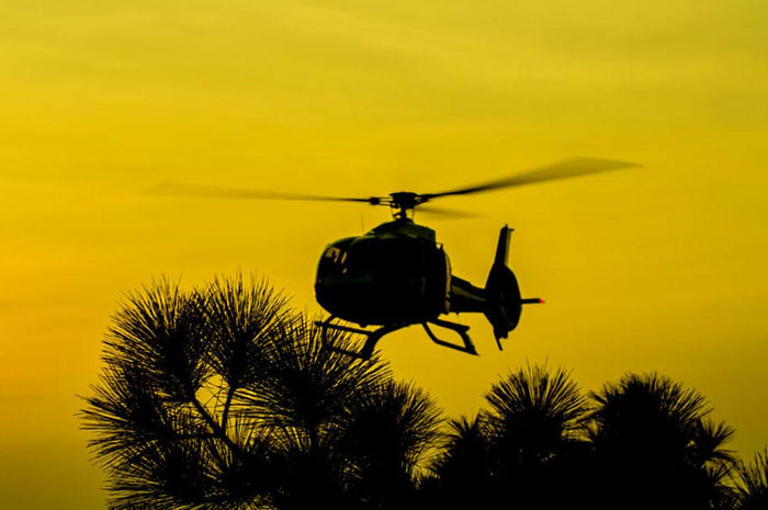 Patrol Helicopter flying in the sky Wall Mural Wallpaper