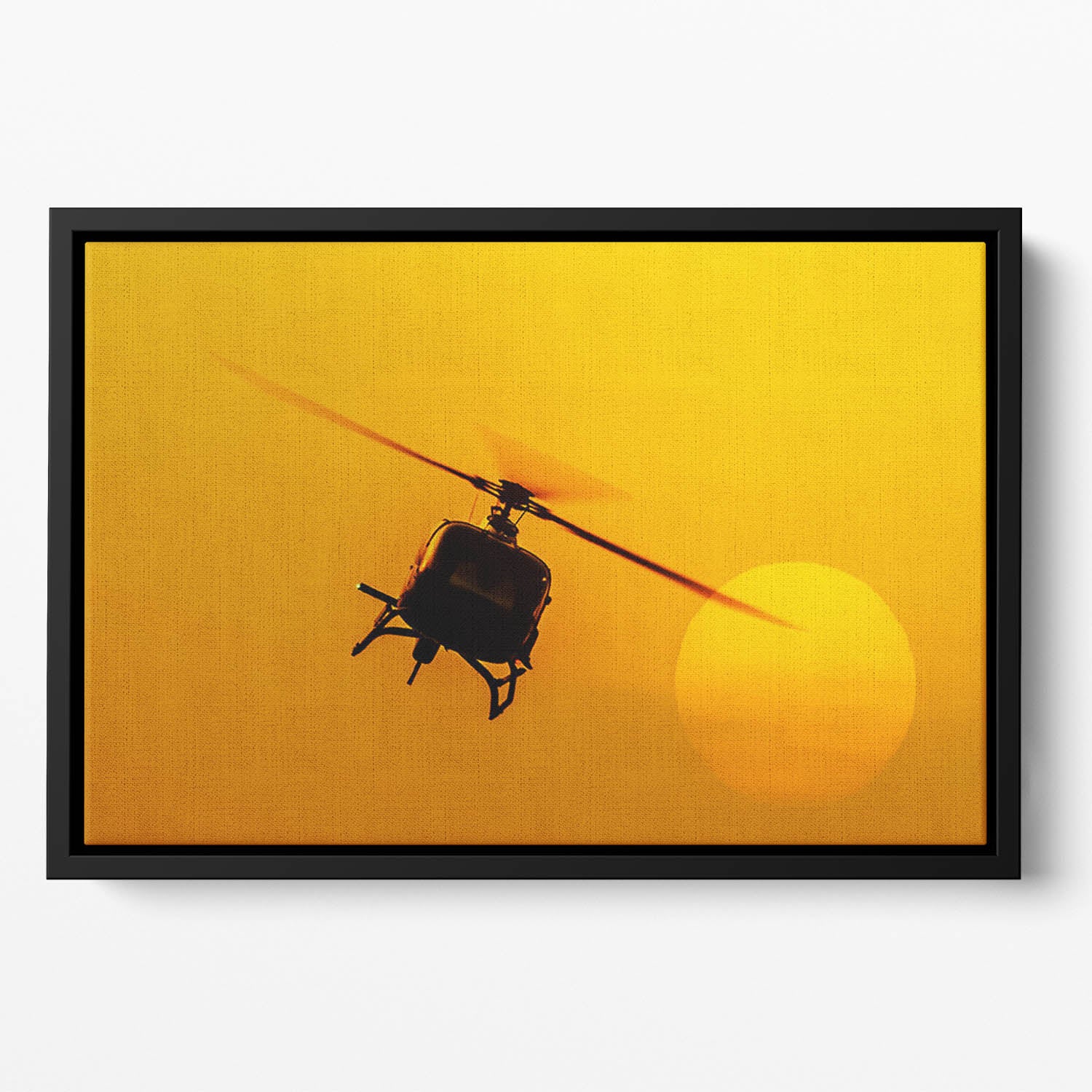 Patrol helicopter flying in sunset Floating Framed Canvas