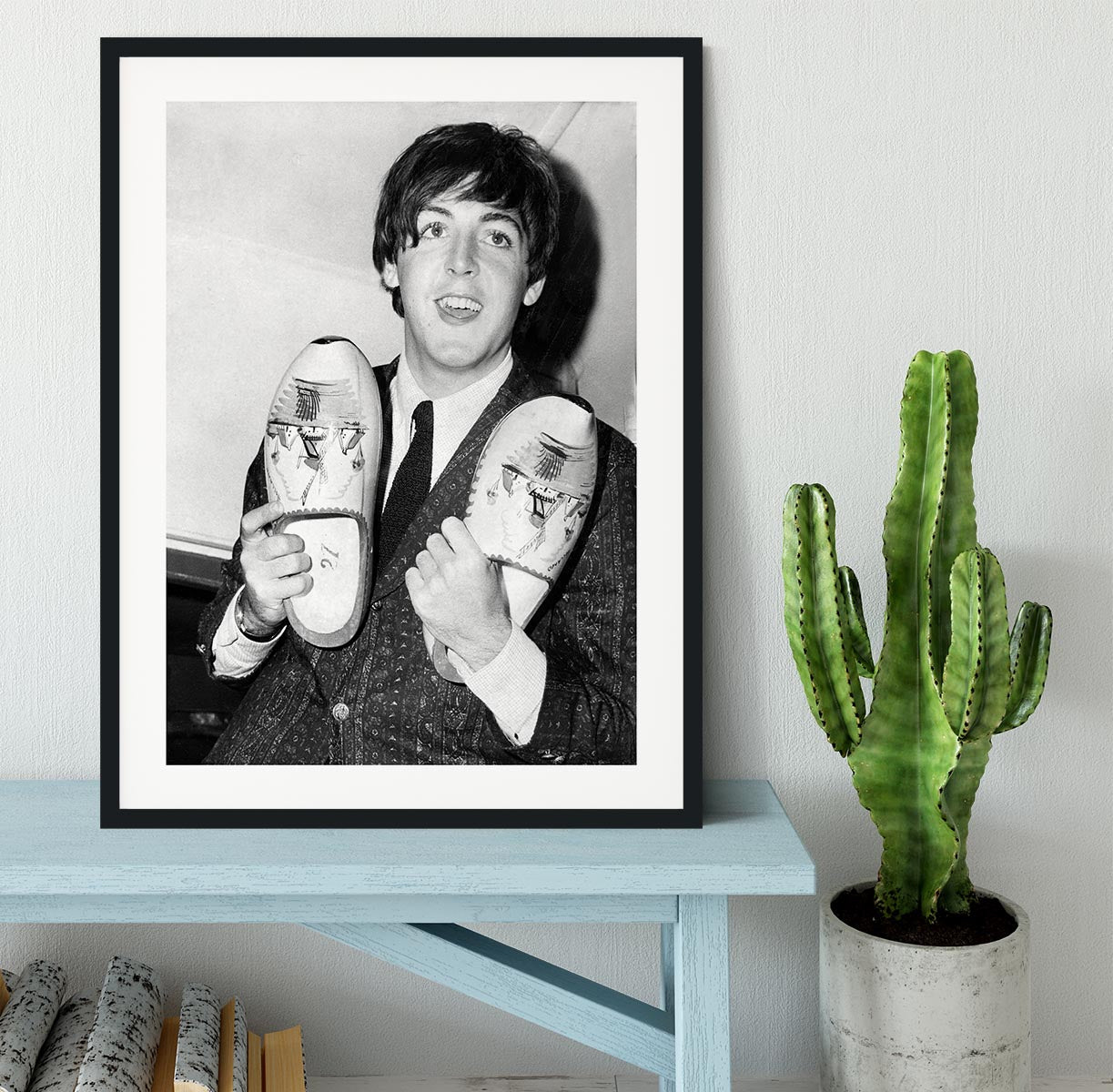 Paul McCartney with a pair of clogs Framed Print - Canvas Art Rocks - 1