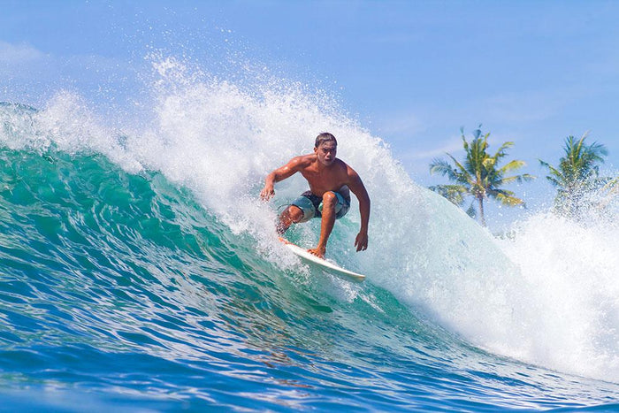 Picture of Surfing a Wave Wall Mural Wallpaper