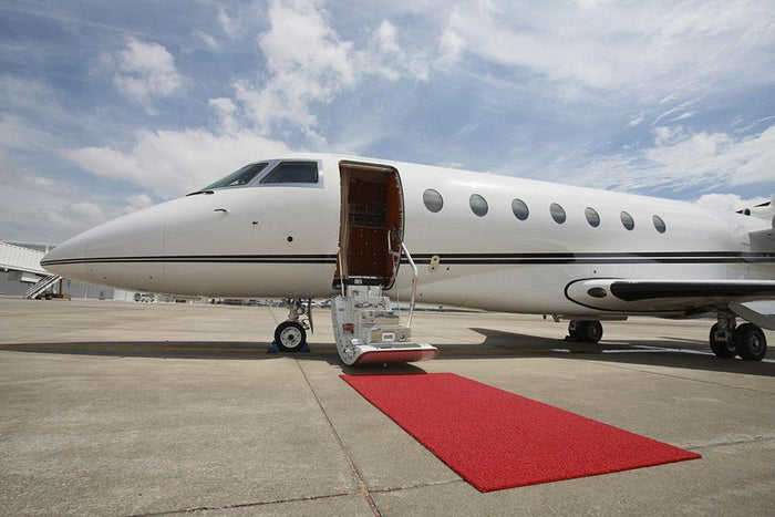 Private airplane with red carpet Wall Mural Wallpaper