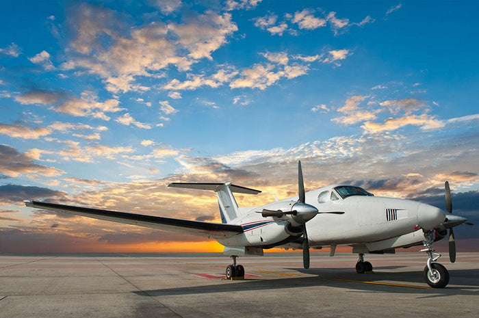 Propeller plane parking at the airport Wall Mural Wallpaper