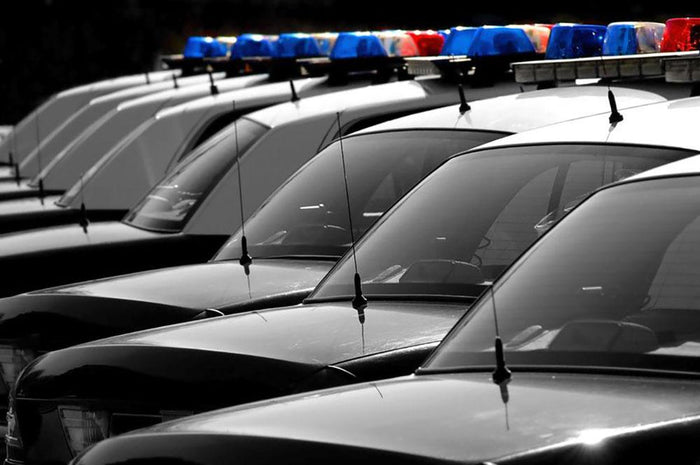 Row of Police Cars with Blue and Red Lights Wall Mural Wallpaper
