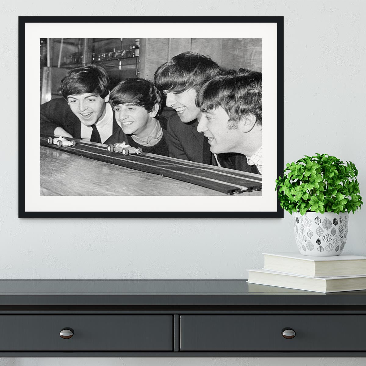 The Beatles play with toy racing cars Framed Print - Canvas Art Rocks - 1