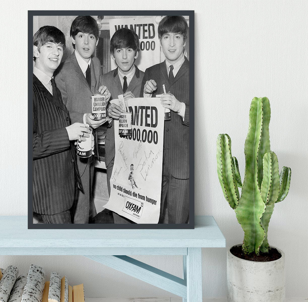 The Beatles with an Oxfam poster Framed Print - Canvas Art Rocks - 2