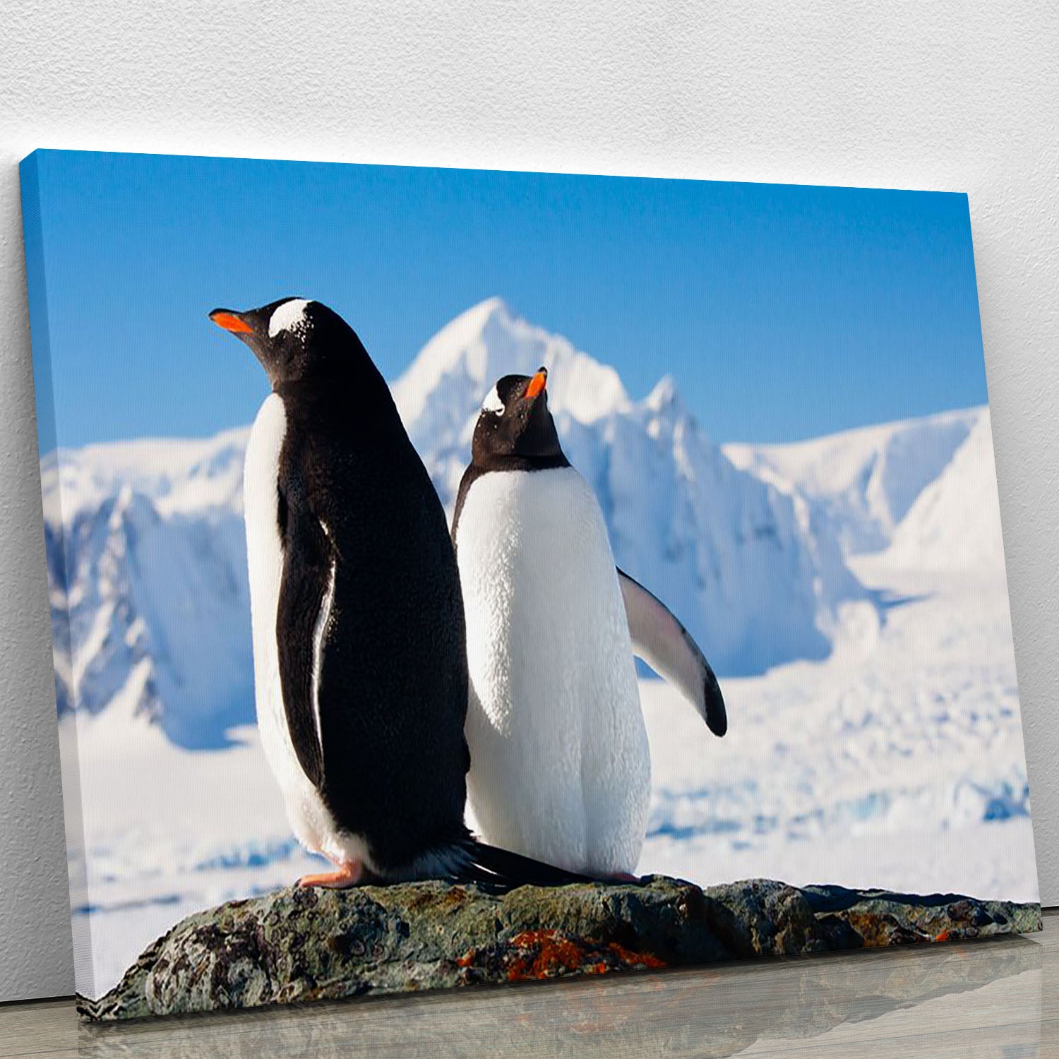 Two penguins dreaming together sitting on a rock Canvas Print or Poster - Canvas Art Rocks - 1